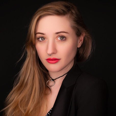 Fashion editorial photo with bold styling, dynamic pose, and high-end lighting setup {{brizy_dc_image_alt imageSrc=