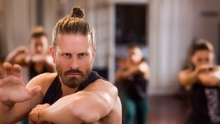 Cinematic studio portrait with dramatic lighting, moody atmosphere, and professional composition {{brizy_dc_image_alt imageSrc=